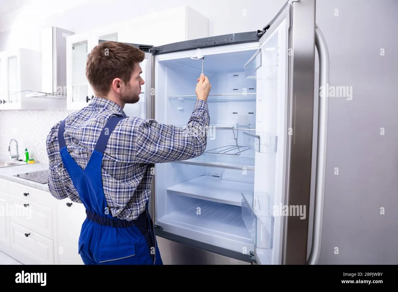 Refrigerator inspection scene in a home kitchen